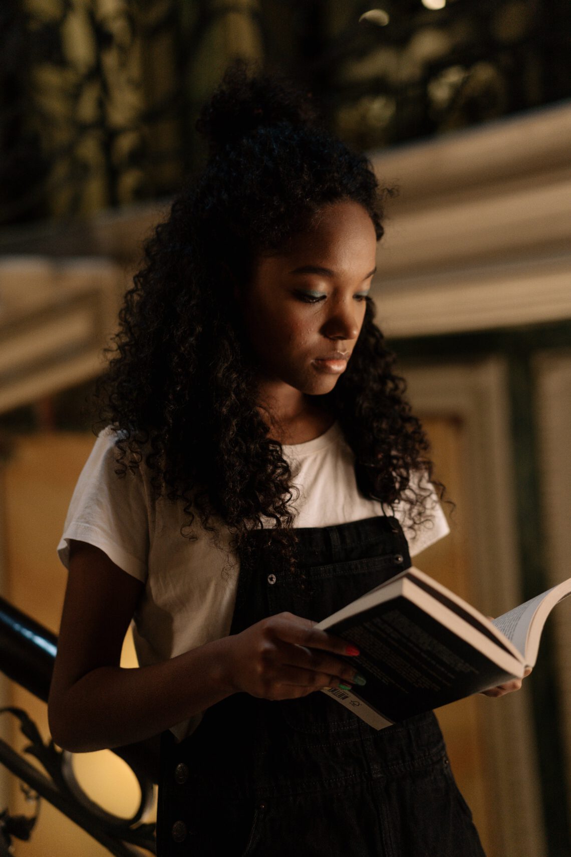 Black Young Woman Reading A Book