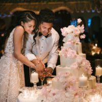 Chanel iman at her wedding cutting her cake
