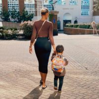 Fanny neguesha walking with her son