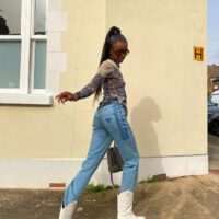 Leomie anderson wearing cowboy boots