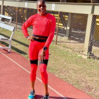 Elaine Thompson red outfit