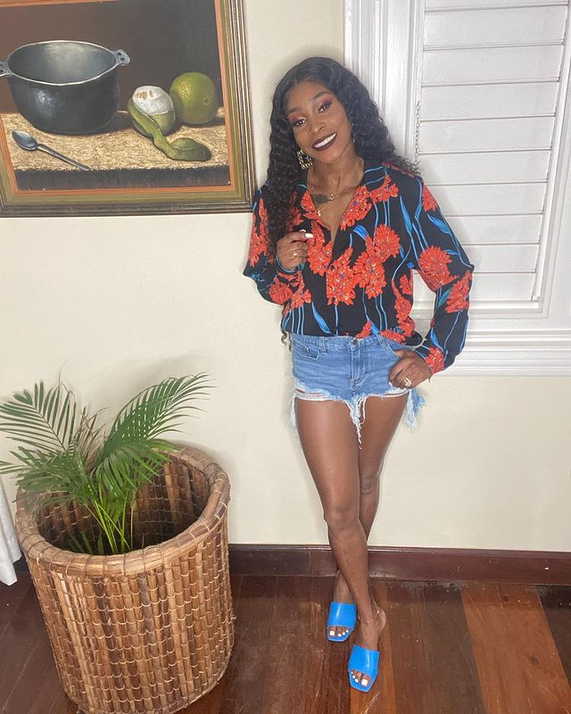 Elaine Thompson with blue slippers