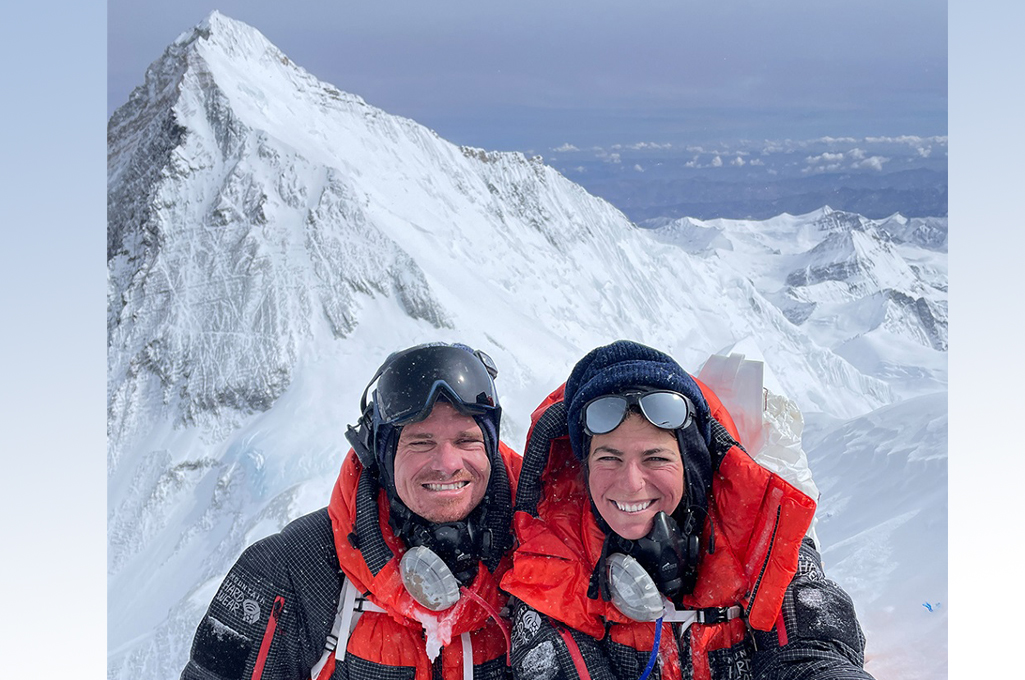 Unger and Lehmann posing on mountain in climbing gear smiling