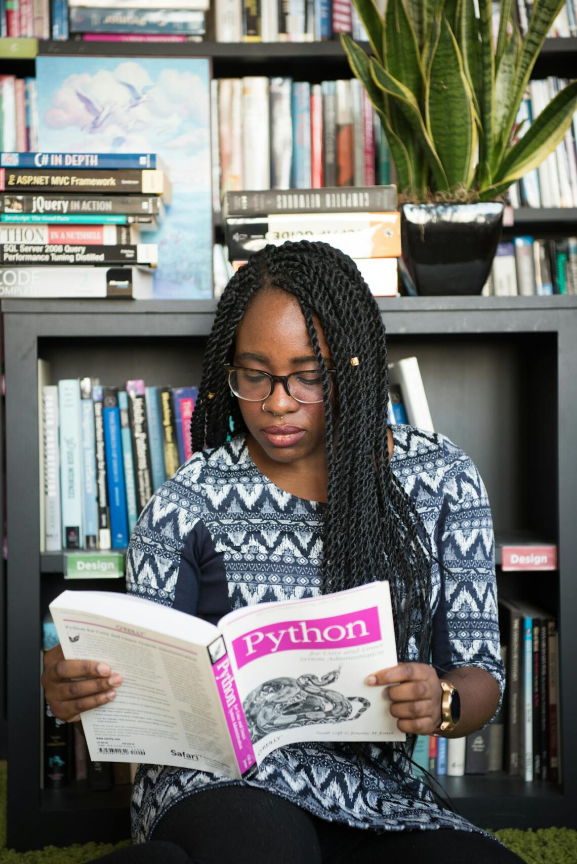 Black Woman Reading Python Book
