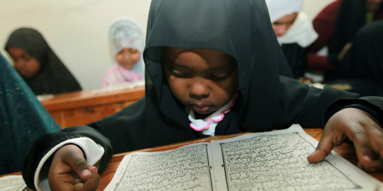 Black Child Reading Quran