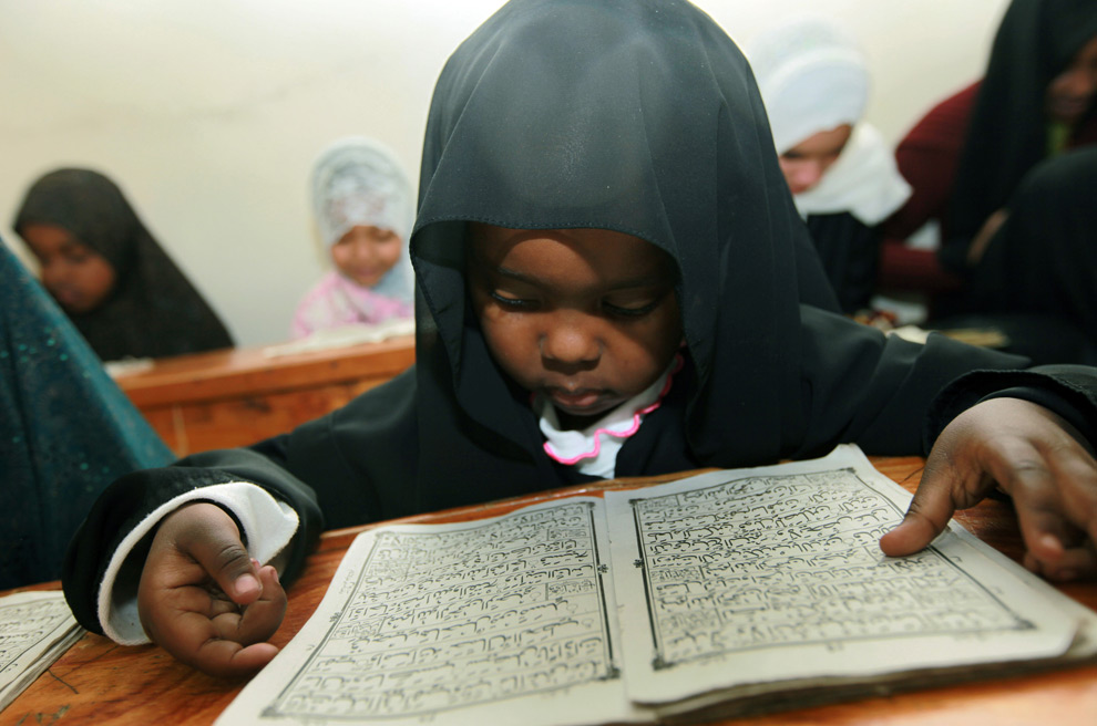 Black Child Reading Quran